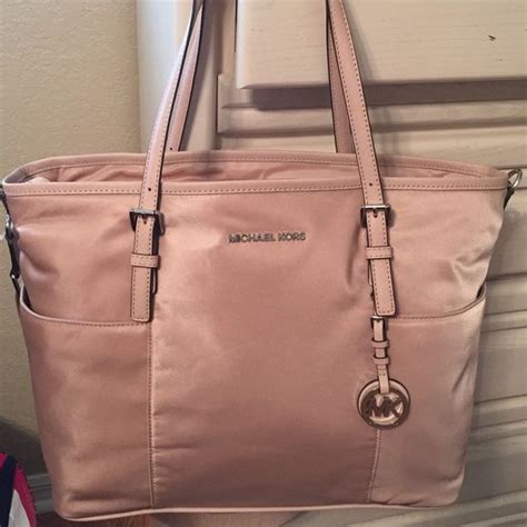 Michael kors diaper bag pink - Tribeca Large Metallic Quilted Leather Shoulder Bag. $358. Shop Similar. Small Metallic Quilted Leather Wallet. $98. Shop Similar. Grayson Small Logo Embossed Patent Duffel Crossbody Bag. $258 $154.80.